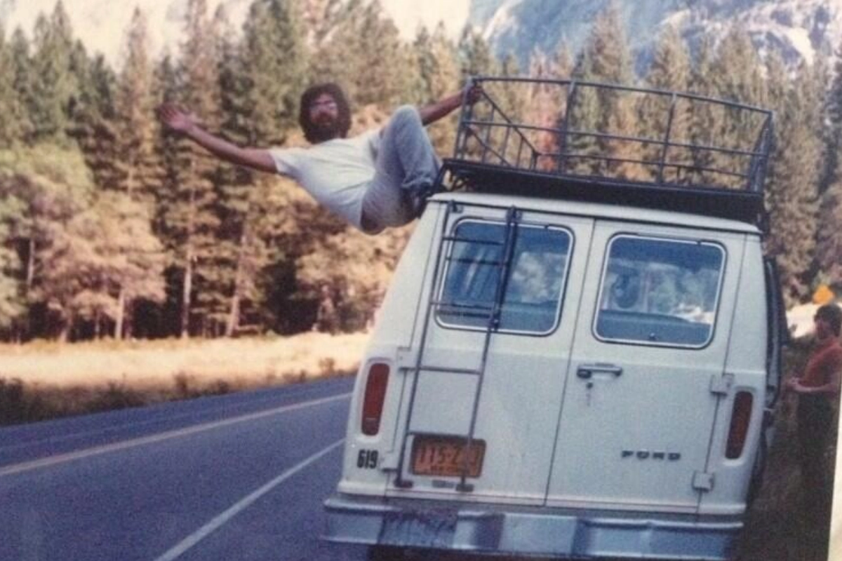 A man on the side of a van who is happy he got his website in 24 hours