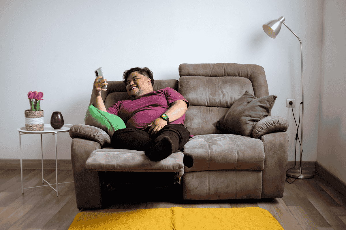 Man sitting on the sofa instead of running his marketing agency